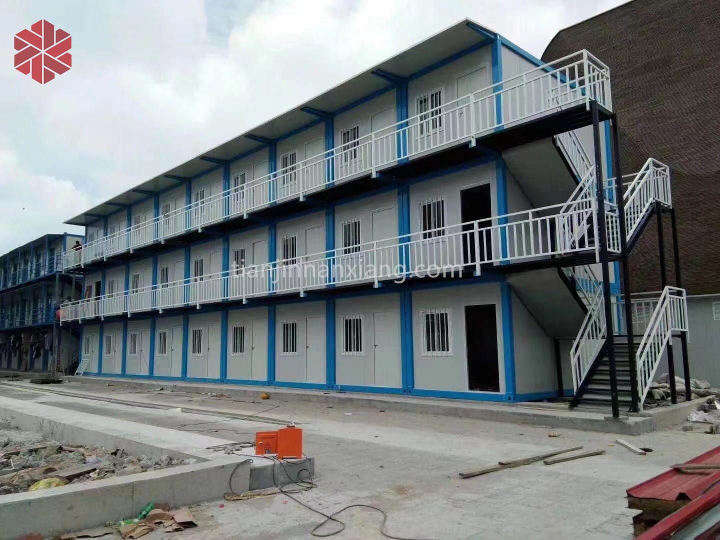 A row of folding container houses used for a camp