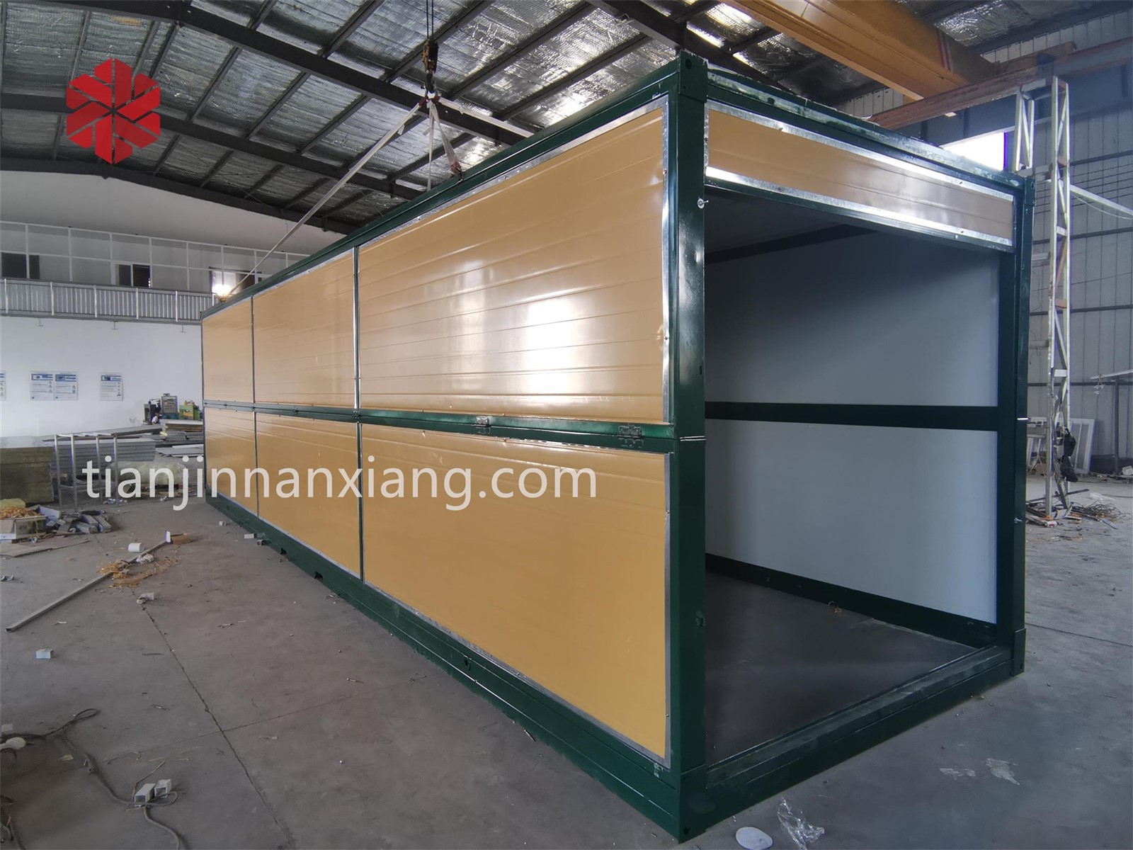 Yellow siding, green frame with custom forklift holes