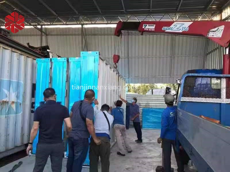 Container home with exterior siding